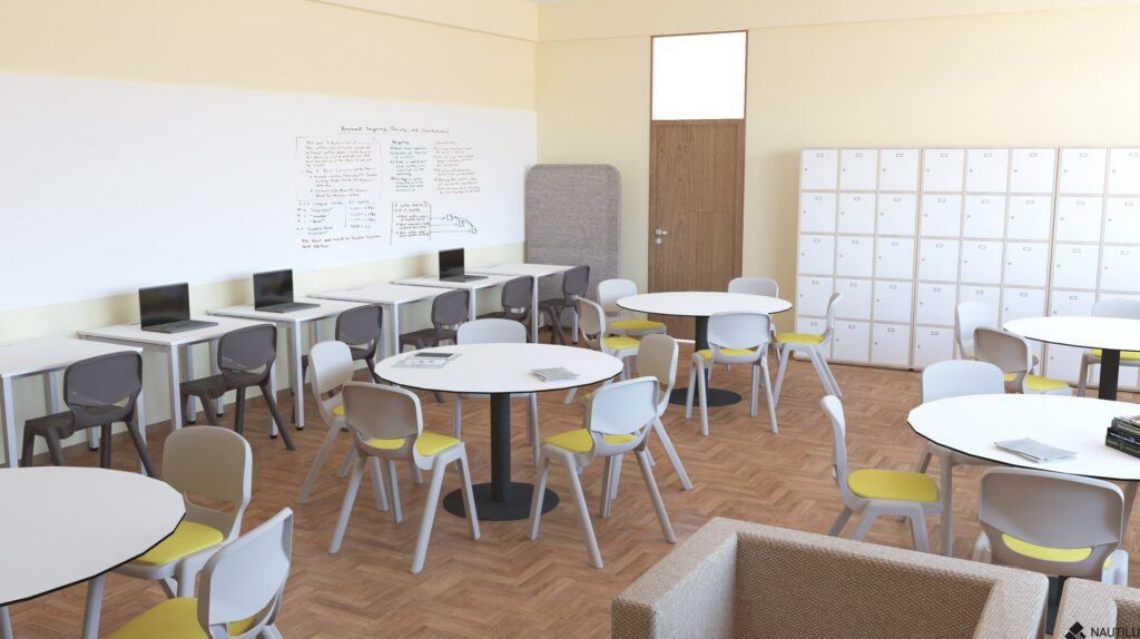 Sala de professores com mesas redondas, cadeiras, computadores portáteis sobre uma bancada e cacifos brancos.