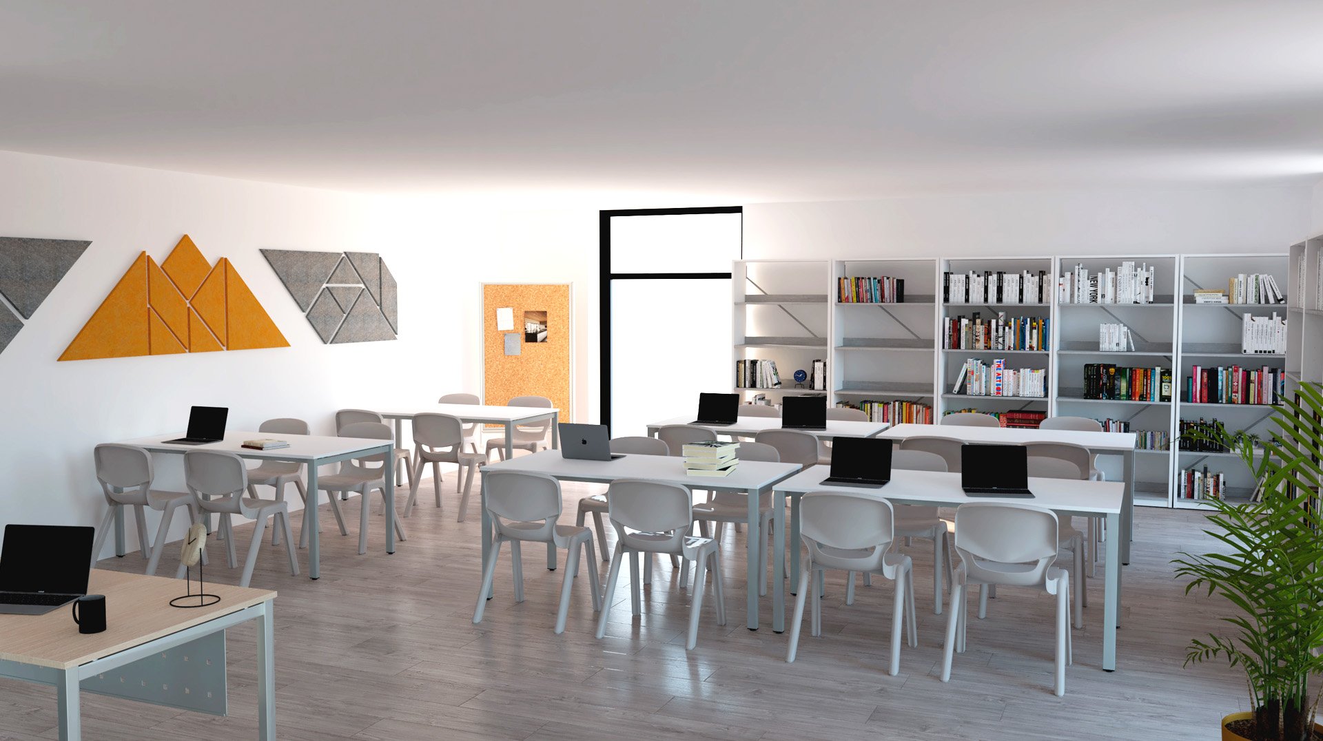 Sala com mesas e cadeiras brancas, computadores portáteis, estantes com livros e decoração geométrica.