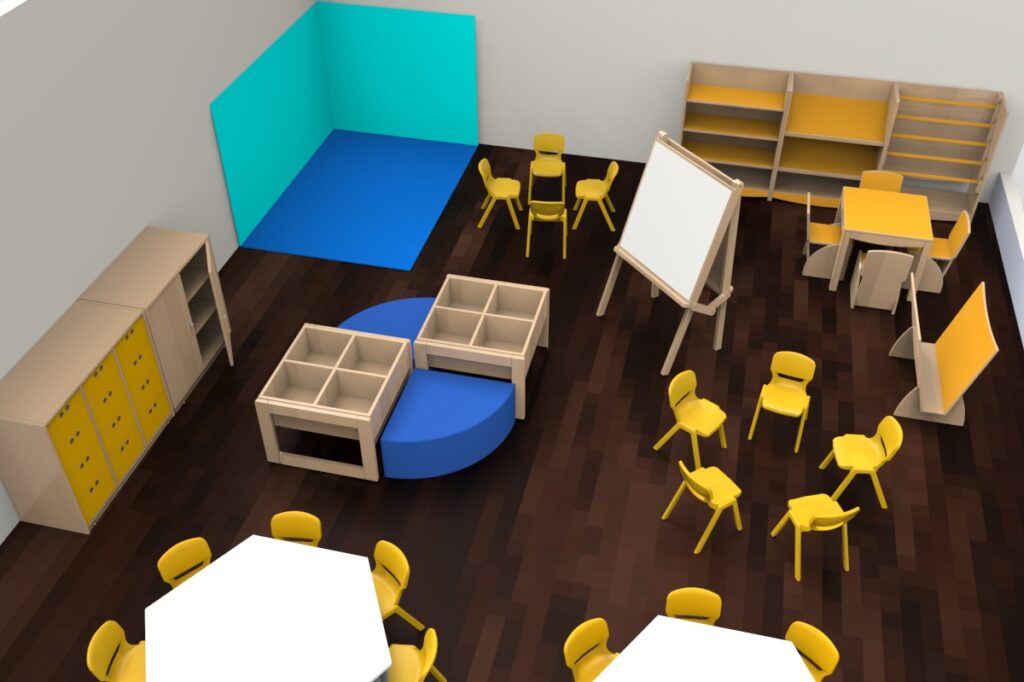 Sala com mesas hexagonais, cadeiras amarelas, arrumação, cavalete e zona de leitura ou brincar.