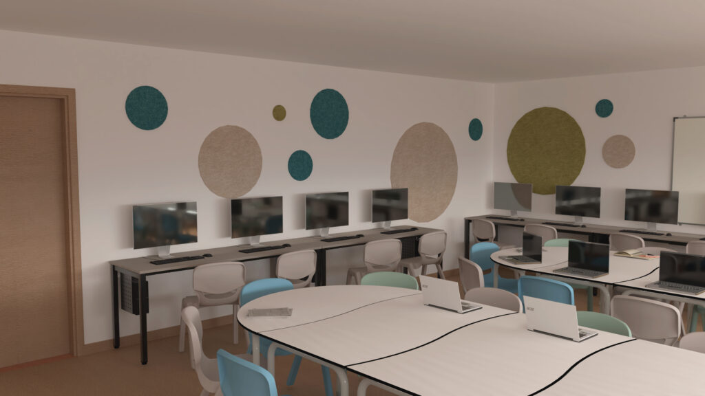 Sala com mesas, computadores, cadeiras azuis-claras e brancas e painéis redondos na parede.