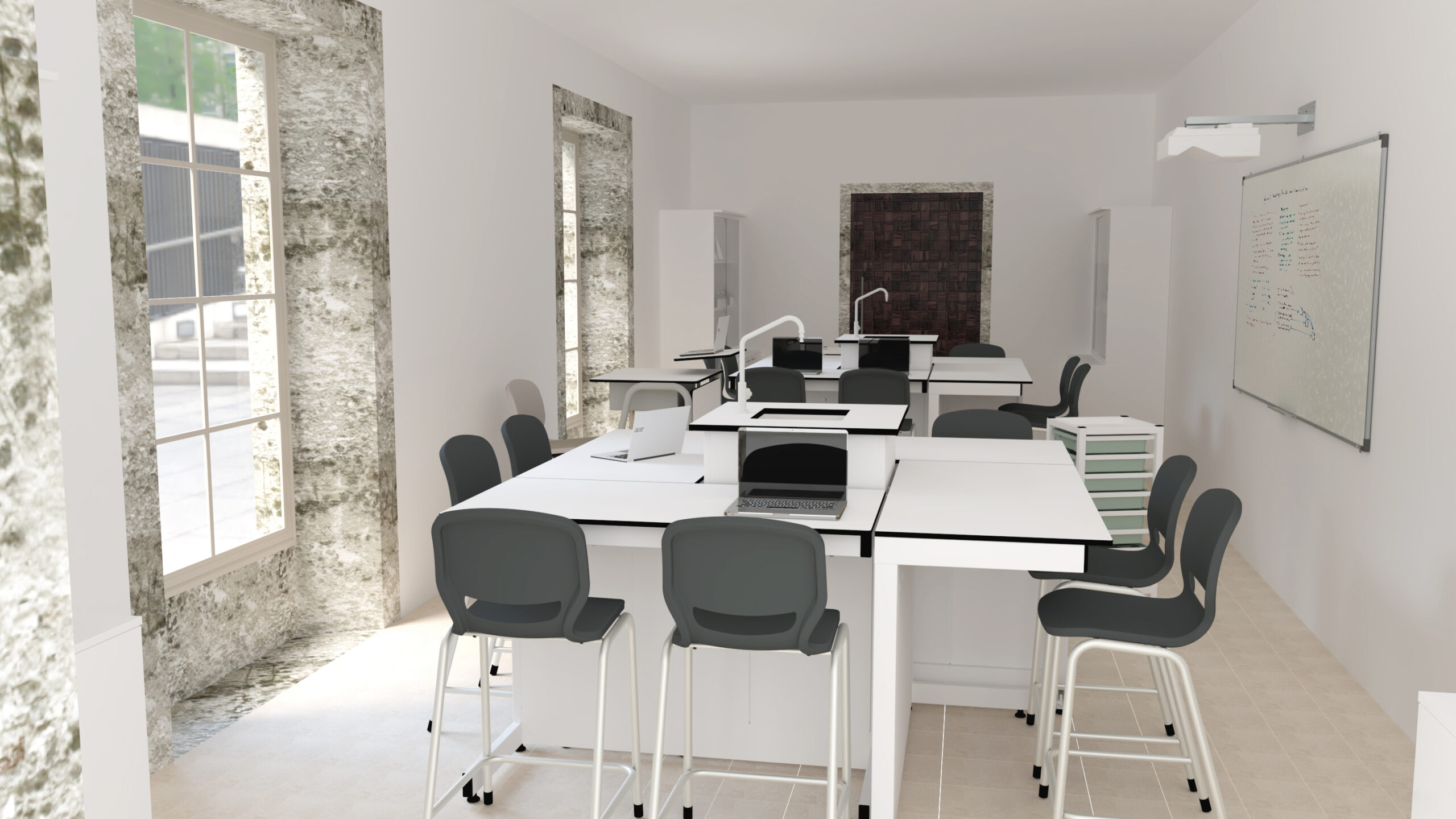 Sala de ciências com mesas brancas, cadeiras cinzentas, computadores e equipamento de laboratório.