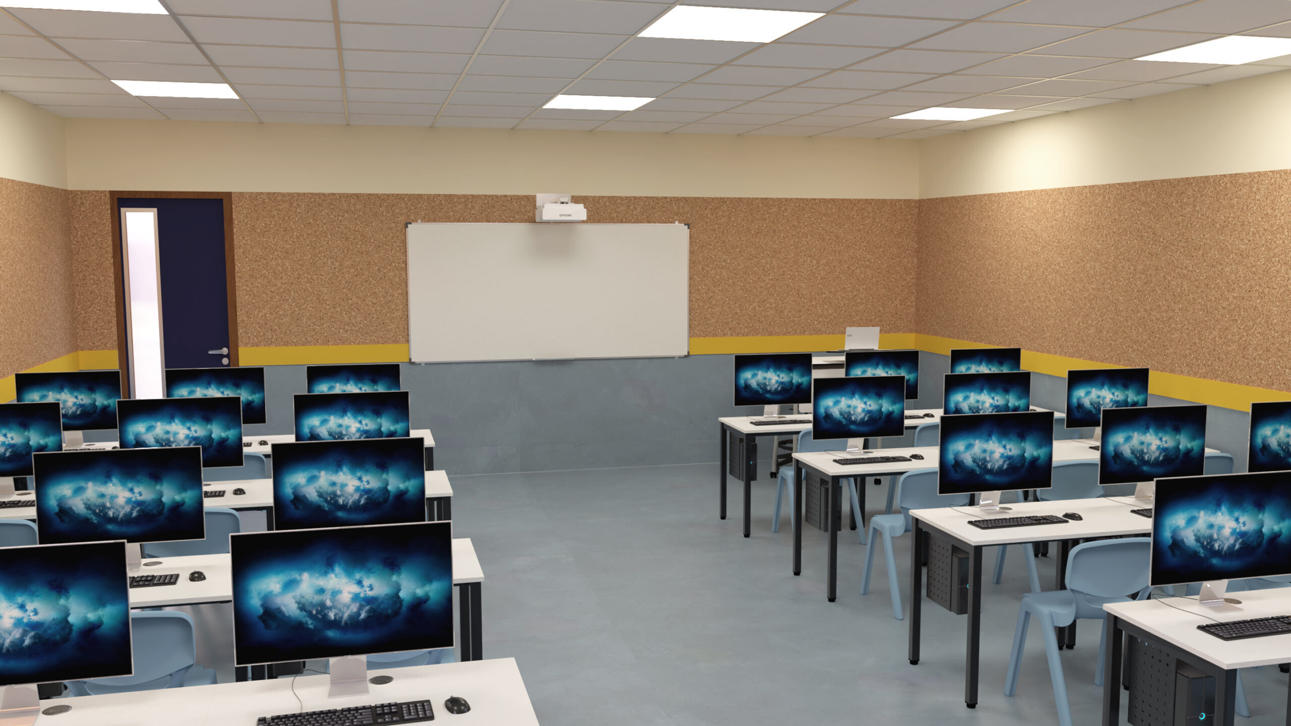 Sala de informática com computadores nas mesas e quadro na parede frontal.