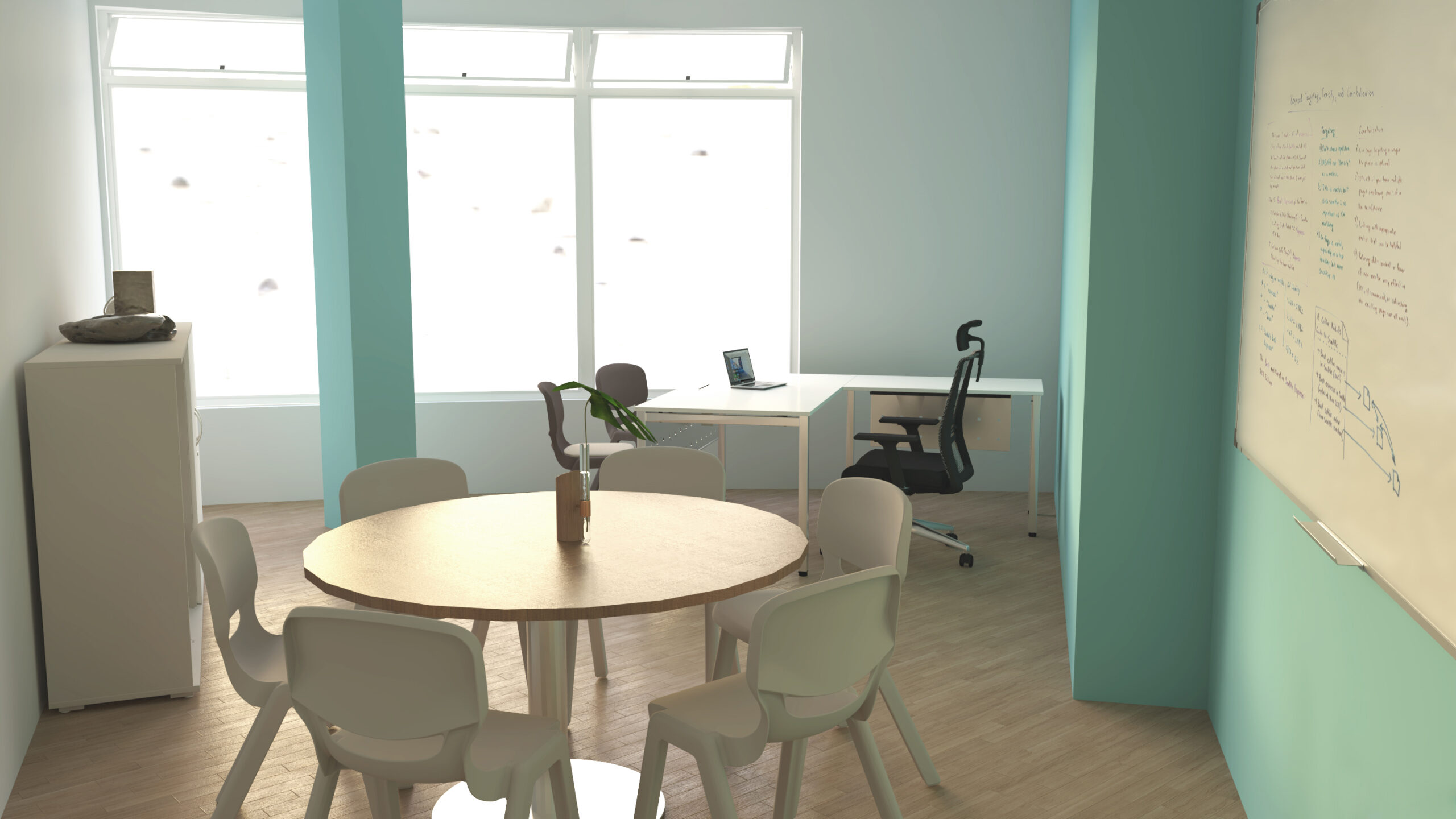 Sala com mesa redonda, cadeiras, quadro branco e posto de trabalho com computador portátil.